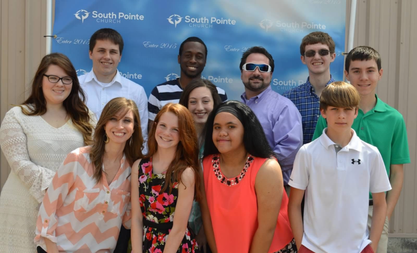 Webb Posing with other leaders and youth at Church